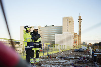 Two engineers working at construction site