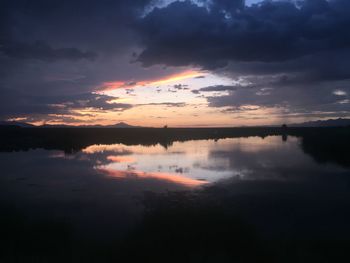 Scenic view of lake at sunset