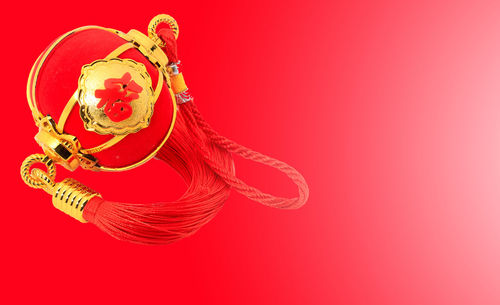 Close-up of hat against red background