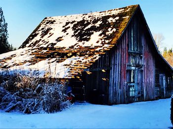 House against clear sky during winter