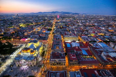 High angle view of illuminated city buildings