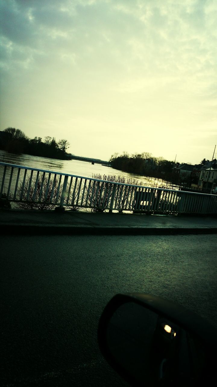 sky, railing, transportation, cloud - sky, water, bridge - man made structure, metal, tranquility, outdoors, silhouette, no people, nature, day, connection, cloud, absence, empty, river, mode of transport, tranquil scene