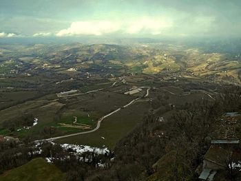 Aerial view of agricultural landscape against sky