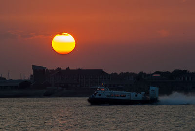 Scenic view of sea against orange sky