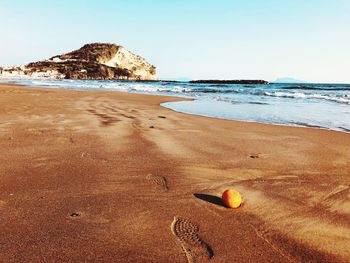 Scenic view of beach against clear sky