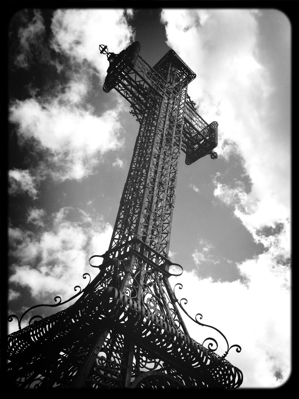 transfer print, sky, low angle view, auto post production filter, built structure, architecture, cloud - sky, famous place, eiffel tower, travel destinations, cloudy, tall - high, international landmark, tower, tourism, travel, history, capital cities, culture, cloud