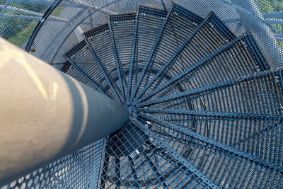 Metal staircase as a spiral staircase leading to a vantage point on a tailings pile.