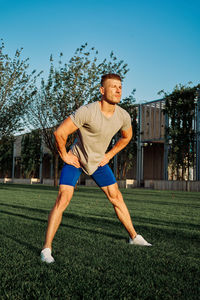 Full length of a man sitting on grass