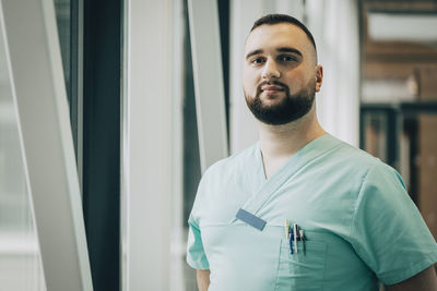 Portrait of confident male healthcare worker at hospital