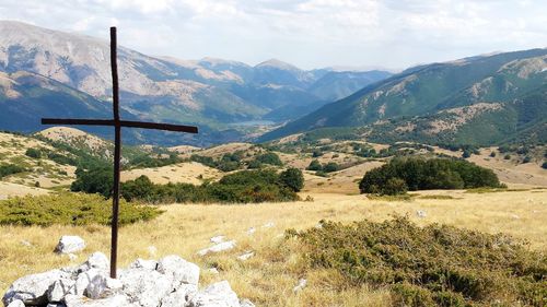 Scenic view of landscape and mountains against sky