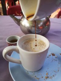 Close-up of coffee cup on table