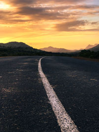 Scenic view of road against sky during sunset