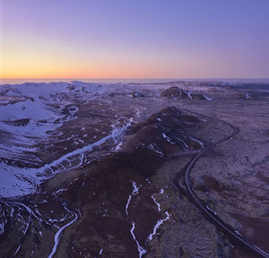 Road going through snowy mountainous terrain