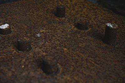 High angle view of rusty metal on table
