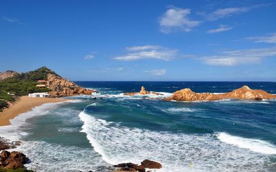 Scenic view of sea against blue sky