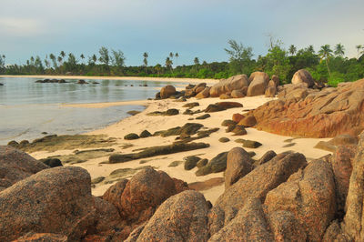 Scenic view of rocks at seaside