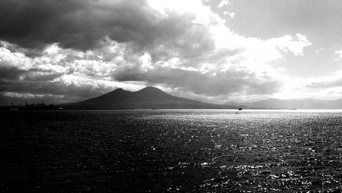 Scenic view of sea against cloudy sky