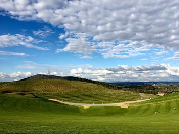 Scenic view of agricultural field against sky