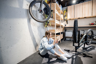 Woman sitting on bicycle