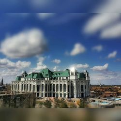 View of buildings against cloudy sky