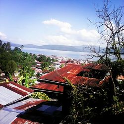 View of town against cloudy sky