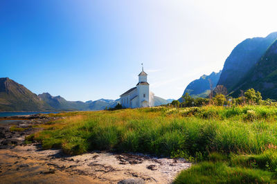 Scenic view of mountains against clear blue sky