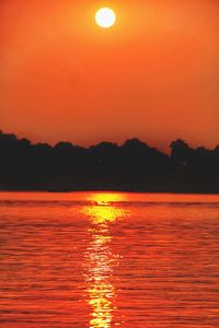 Scenic view of lake against romantic sky at sunset