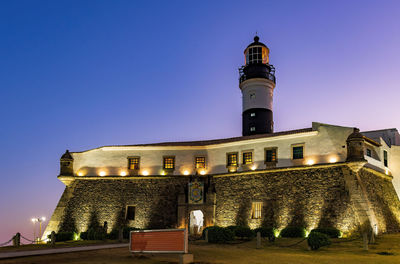 Sunset at the barra lighthouse, one of the main tourist attractions in the city of salvador, bahia