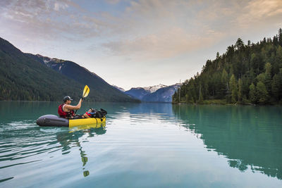 Father and son paddling on cheakamus lake, whistler b.c.