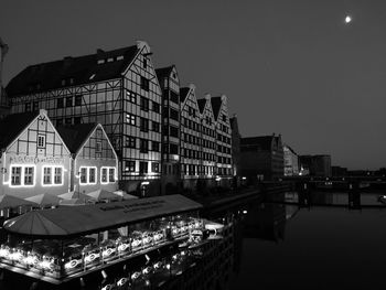 Buildings in city at night