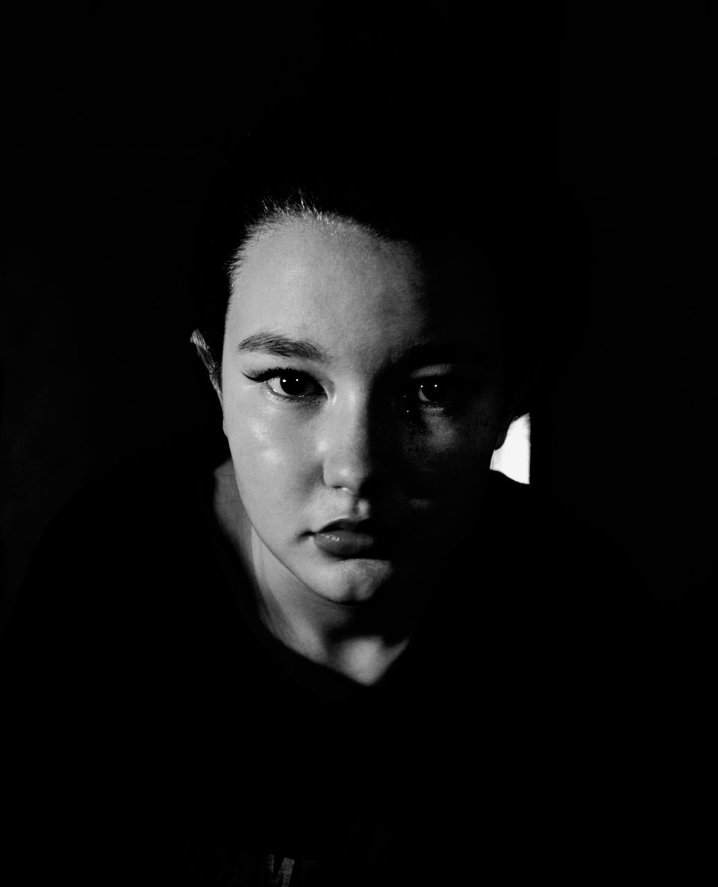 portrait, black, one person, black and white, darkness, headshot, looking at camera, black background, indoors, adult, monochrome photography, studio shot, front view, monochrome, young adult, dark, white, women, serious, copy space, human face, close-up, lifestyles, portrait photography