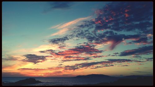 Scenic view of sea against cloudy sky