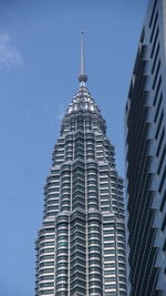 Low angle view of modern buildings against sky