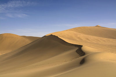 Scenic view of desert against sky