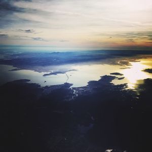 Scenic view of sea against sky at sunset