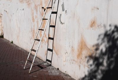 Empty chair against wall