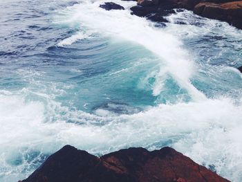 Waves splashing on rocks
