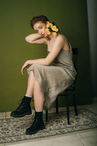 Portrait of woman sitting on chair