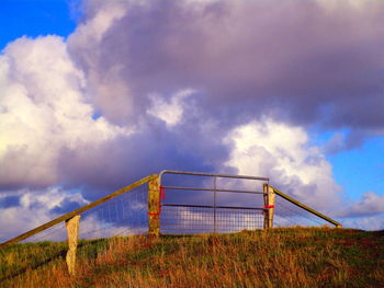 View of soccer field against cloudy sky