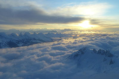 Scenic view of snow mountains against sky during sunset