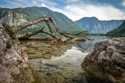 Scenic view of lake and mountains against sky