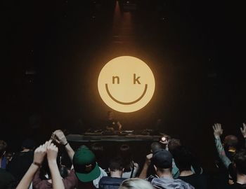 People enjoying music concert at night