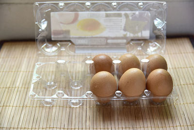 Close-up of eggs in glass on table