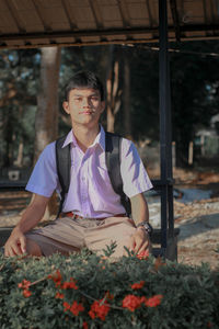 Portrait of young man standing outdoors