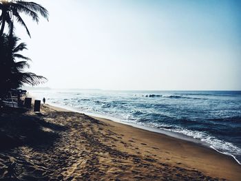 Scenic view of beach against clear sky