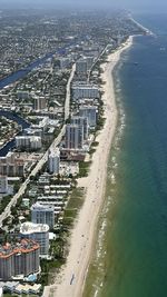 High angle view of cityscape by sea