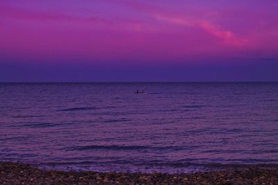 Scenic view of sea at sunset