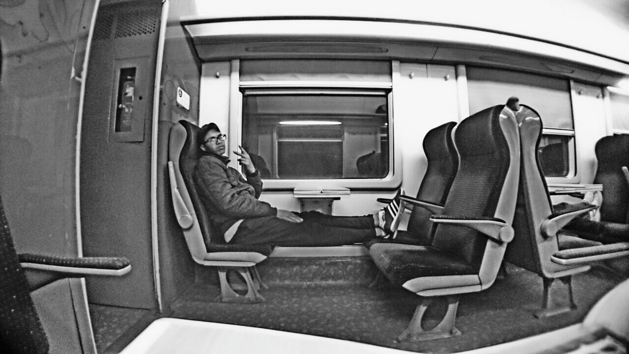 PEOPLE SITTING IN TRAIN