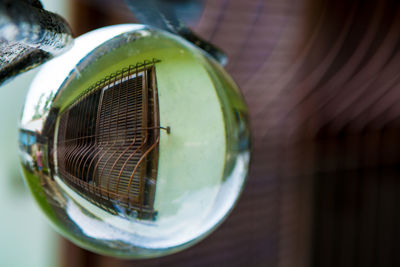 Reflection of house on crystal ball