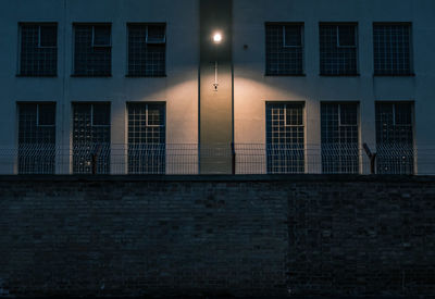 Illuminated lighting equipment mounted on prison building